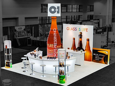 KOTLA-USA peninsula booth open on three sides, drawing attention from multiple directions.